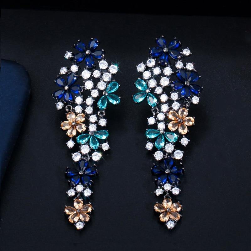 Dazzling Flower AAA+ CZ Paved Black Gold Long Drop Champagne Blue Earrings - The Jewellery Supermarket